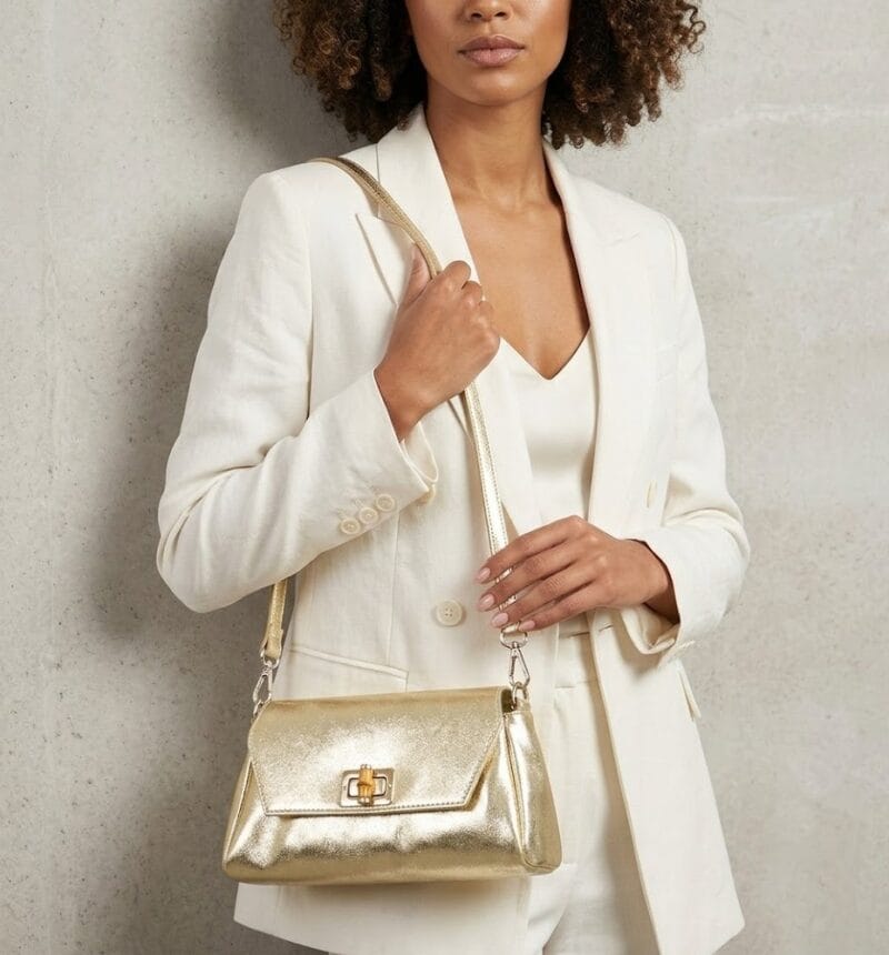 Leren Schoudertas Cilinia zilver zilveren leren clutch pouchette houten draaislot dames tasjes tassen leer leder kopen bestellen model